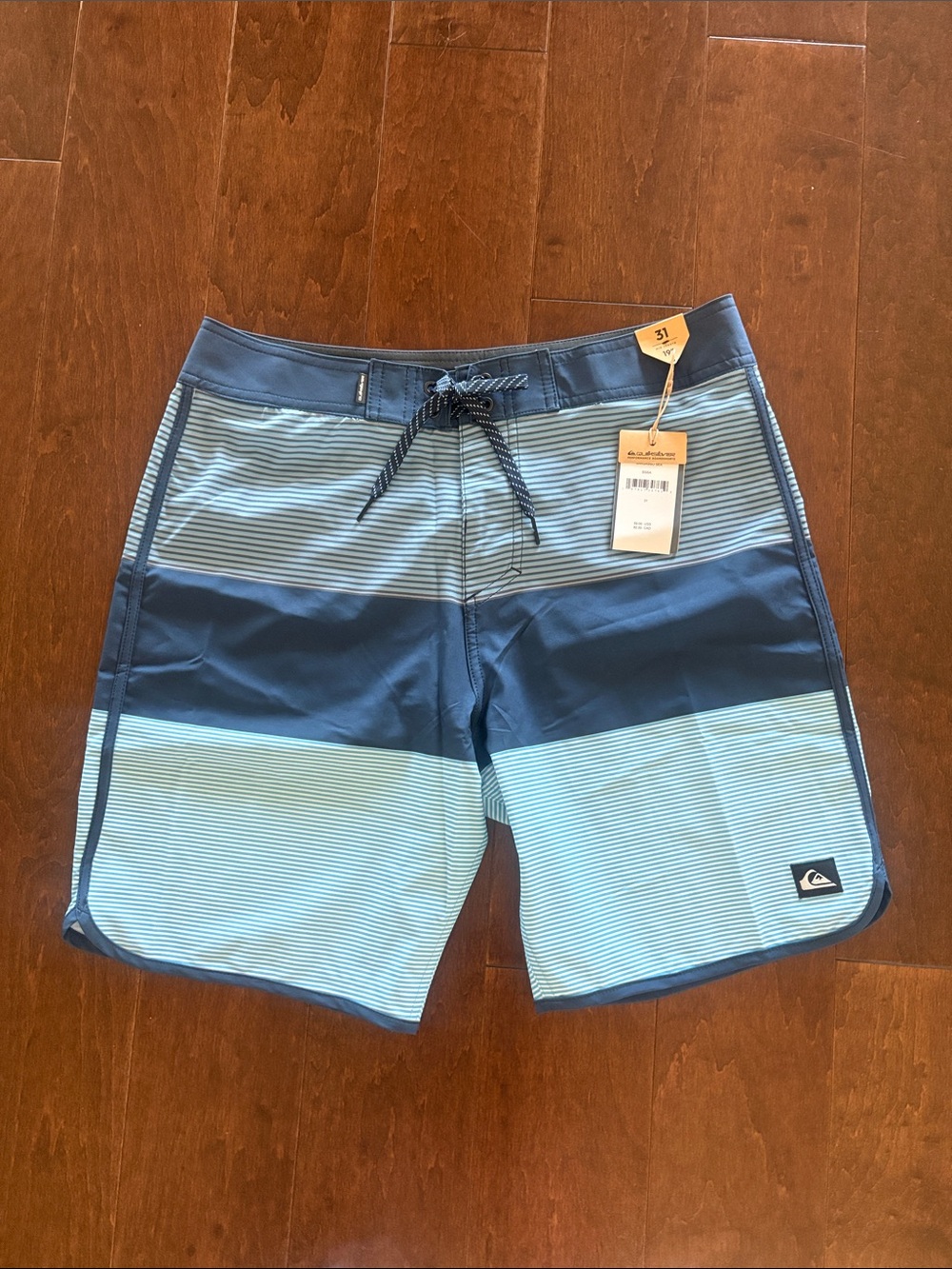 Quiksilver Men’s Navy and Light Blue Striped Boardshorts
NWT